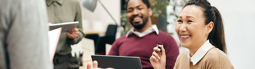 People smiling while in an office meeting